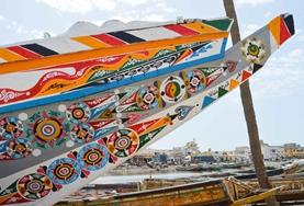 Volunteer Language Courses Painted boats in St Louis, Senegal, where we run our French language course.