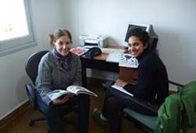 Volunteer Language Courses A volunteer learns Spanish from her language course tutor in Argentina.