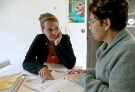 Volunteer Language Courses A volunteer works through an exercise with her Spanish tutor as part of her language course in Mexico.