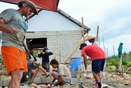 Volunteer Philippines Volunteers work on the construction of a foundation for a new classroom being built in the Philippines.