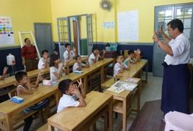Volunteer Myanmar A childcare volunteer teaches students at a school for the deaf in Myanmar.