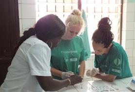 Volunteer Togo Volunteers working at our HIV/Aids placement in Togo assist local medical staff with administering HIV tests during an outreach.