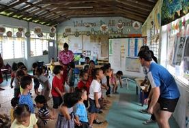 Volunteer Culture & Community A group of volunteers spends time with children in a local village in Samoa during their cultural immersion project.