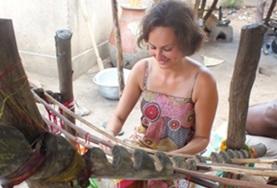 Volunteer Togo An Arts & Crafts volunteer learns how to weave using a traditional loom at her placement in Togo.