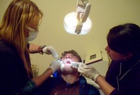 Volunteer Medical Electives A local dentist demonstrates a dental problem to a Dentistry Elective intern in an Argentinian hospital.