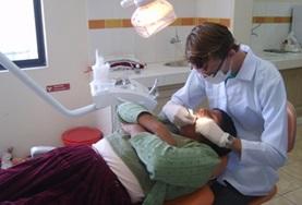 Volunteer Medical Electives A Dentistry Elective intern examines a patient's teeth under the guidance and supervision of a local dentist in Bolivia.