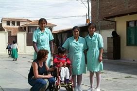 Volunteer Medical Electives Medicine Elective interns work together with local staff to treat a child with disabilities in Bolivia.