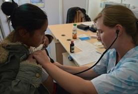 Volunteer Medical Electives A volunteer working towards her Medicine Elective in Mongolia uses a stethoscope to check a local woman's heart rate.