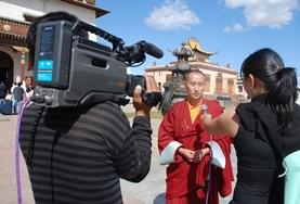 Volunteer Journalism A Journalism intern interviews a local person for a news station in Mongolia, Asia.