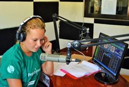 Volunteer Journalism A Journalism intern makes a recording for a local radio station during her internship in the Philippines.