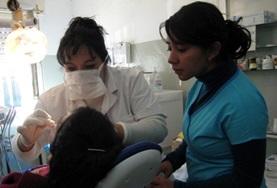 Volunteer Medicine & Healthcare A volunteer observes as a local dentist examines a patient at our Dentistry internship placement in Argentina.