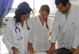 Volunteer Medicine & Healthcare A local doctor speaks to Medicine interns about a patient's file during their Medical internship in Morocco.