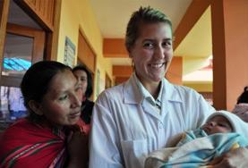 Volunteer Medicine & Healthcare A Midwifery intern holds a newborn baby at her volunteer placement in Peru.