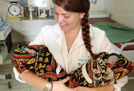Volunteer Medicine & Healthcare A Midwifery volunteer holds two newborn babies at her placement in the maternity department of a hospital in Tanzania.