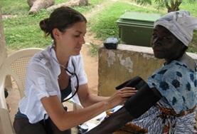 Volunteer Medicine & Healthcare A local women has her blood pressure measured by a Nursing intern assisting at our volunteer placement in Ghana.