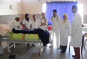 Volunteer Medicine & Healthcare Nursing volunteers doing internships in Morocco observe as a local local doctor speaks to a patient about his symptoms.