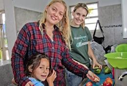 Volunteer Bolivia Nutrition volunteers cook healthy meals which will be distributed in a local community in Bolivia.