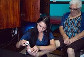 Volunteer Medicine & Healthcare A Physiotherapy intern works with an elderly patient in Costa Rica, stretching her muscles and helping to strengthen her legs.