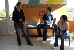 Volunteer Medicine & Healthcare Physiotherapy interns volunteering in Romania listen as a local physiotherapist teaches them about therapy techniques.