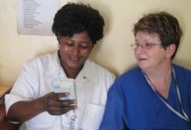 Volunteer Medicine & Healthcare A Physiotherapy volunteer speaks to a local medical staff member about treatment techniques in Tanzania.