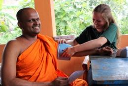 Volunteer Medicine & Healthcare A Public Health volunteer in Sri Lanka measures a local man's blood pressure, gaining important medical experience during her internship.