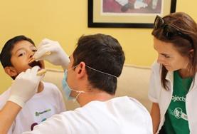 Volunteer Dentistry A volunteer observes a dental check-up at one of our Dentistry internship placements.