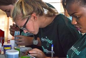 Volunteer Pharmacy Pharmacy interns sort through medication and help with distributing it to members of a local community during a volunteer outreach.