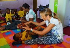 Volunteer Physiotherapy A Physiotherapy volunteer does light stretches with a boy at a care centre as part of one of our medical internships.