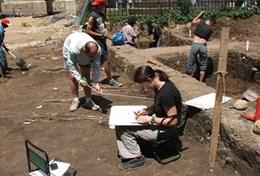 Volunteer Archaeology A professional archaeologist records details about a dig site at our volunteer placement in Transylvania, Romania.