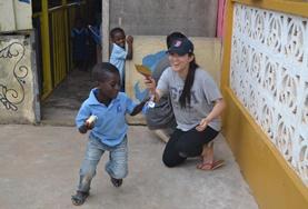 Volunteer Care A qualified social worker plays a game with local children at her volunteer placement in Ghana.