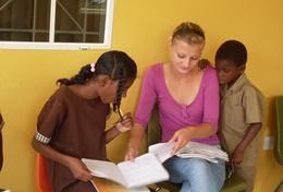 Volunteer Care A qualified social worker does an activity with two local children at our volunteer placement in Jamaica.