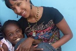 Volunteer Medicine & Healthcare A qualified physiotherapist volunteering in Jamaica works with a child in a local hospital.