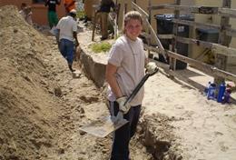 Volunteer Building A High School Special Building volunteer assists with laying the foundation for a new house in South Africa.