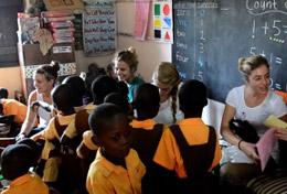 Volunteer Care High school students volunteering in Ghana hold a creative, fun lesson with local children.