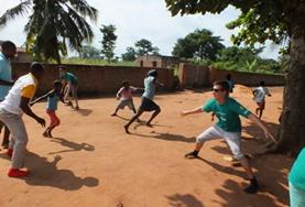 Volunteer Care High School Special volunteers play a game with local children in Togo to help with their physical development and teamwork.