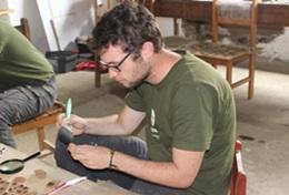 Volunteer Archaeology A High School Special Archaeology intern catalogues the artifacts found during a dig in Peru.