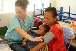Volunteer Cambodia A high school student gains medical experience by measuring blood pressure during a volunteer Public Health outreach in Cambodia.