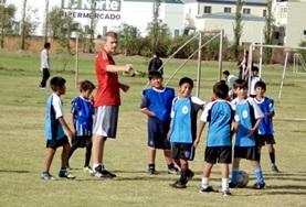 Volunteer Bolivia A Football volunteer coaches a local team of children in Bolivia, helping them work on their ball skills.