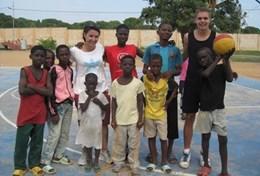 Volunteer Ghana A Sports volunteer poses with a group of children after coaching them and improving their fitness at our Multi-sports placement in Ghana.