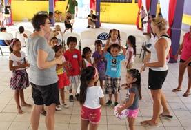 Volunteer Belize School Sports volunteers play a ball game with young children in Belize to promote physical development and fitness.