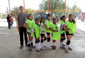 Volunteer Sports A Sports volunteer coaches a team of volleyball players in Bolivia.