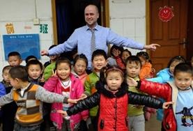 Volunteer China A Teaching volunteer plays an interactive educational game with local school children in China.