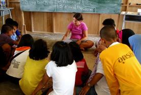 Volunteer Thailand A Teaching volunteer runs a creative lesson with students at a local school in Thailand.